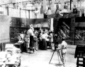 Image 2A.E. Smith filming The Bargain Fiend in the Vitagraph Studios in 1907. Arc floodlights hang overhead. (from History of film)