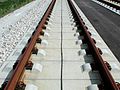Gleis auf fester Fahrbahn mit Linienleiter