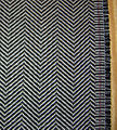 Example of the herringbone pattern, a popular choice for suits and outerwear