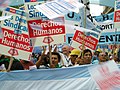 Image 8Union members march in Argentina on Human Rights Day in December 2005. The signs read "Worker rights are human rights..