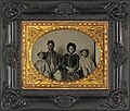 African American Union soldier in uniform with family; he has been identified as Sgt. Samuel Smith of the 119th USCT[25]