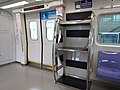 The luggage rack and train door of the 1000 series