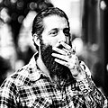 Image 93A man with sleeve tattoos, beard and flannel shirt, mid 2010s (from 2010s in fashion)