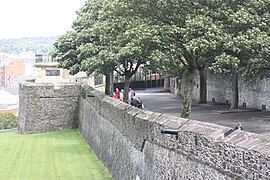 A photo of the walls of Derry with the plinth of the Walker Pillar on a bastion