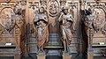 The church interior is decorated with ornate wooden carvings, such as these four angels on the left side of the main hall