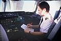 A pilot consulting his checklist