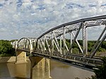 The four span through truss General Hertzog Bridge over the Orange River at Aliwal North carries vehicular traffic