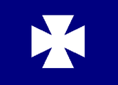 Badge of the 2nd Division, V Corps, Army of the Potomac. White cross pattée on azure field.