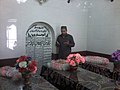 A visitor praying Al Fateha at the graves of tomb of Allo Mahar Shreef