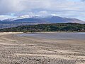 Carradale Beach with the snow-capped hills of the Isle of Arran in the distance.
