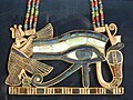 Eye of Horus pectoral. hieroglyphs: Red crown, White crown, Shen ring, uraeus, mut vulture, Eye of Horus