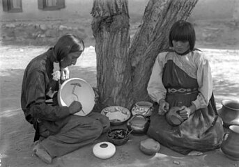 Julian and Maria Martinez decorating pottery, c.1912