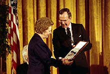 Thatcher standing with George H. W. Bush
