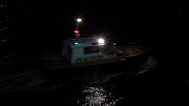 Pilot boat in Almeria, Spain, showing the white-over-red night lighting
