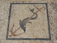 Mosaic decoration of a dolphin wrapped around an anchor
