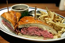 French Dip sandwich with au jus and french fries