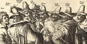 A monochrome engraving of eight men, in 17th-century dress; all have beards, and appear to be engaged in the discussion.