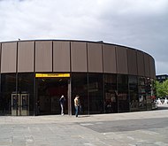 The former 1980s circular station building, prior to demolition in the late 2000s.