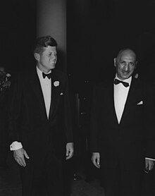A black and white photograph from 1963 showing Mohammed Zahir Shah, King of Afghanistan, and John F. Kennedy, President of the United States.