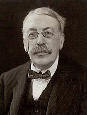 Man in late middle age, wearing pince-nez and a moustache
