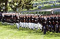 Escort platoons march in the United States Naval Academy Cemetery as part of the funeral procession for former Chairman of the Joint Chiefs of Staff, Admiral William J. Crowe in 2007.