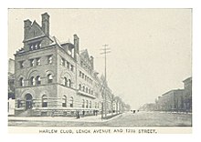 Four-story stone building on the left, unpaved street on the right