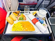 Airline premium economy in-flight meal. Viennese sweet pepper chicken with spaetzle.