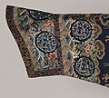 Manchu's Horsehoofs cuffs decorated with xiangyun, lishui, woshui, floral medaillon, and hongfu (red bats).