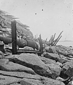 Exterior view of Fort Sumter, 1865. Banded rifle in the foreground, fraise at the top.