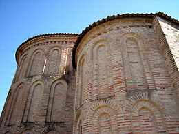 Blind arcading in brick in the Mozarabic style of Asturia and Leon on the apse of Castro de Avelãs Monastery, a unique example in Portugal.