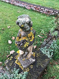 Statue of Summer holding a garland in the sunken garden