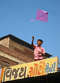 G-19. (Kite flying) A boy flies a kite