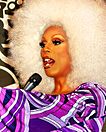Drag queen RuPaul speaking into a microphone