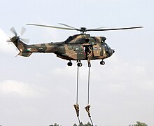 Soldiers fast roping from an Oryx helicopter
