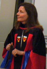 Portrait of Patricia Burchat in robes at graduation