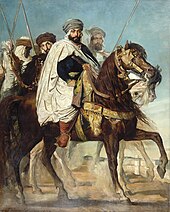 Cloaked and turbaned man on a spirited charger, accompanied by an armed escort