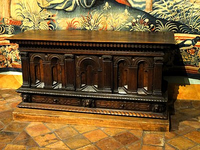 Carved chest in the bedroom of the Queen, with architectural decoration