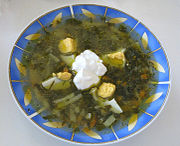 Green borscht with egg and sour cream