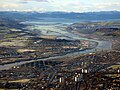 Aerial view looking downstream along the River Clyde to the Erskine Bridge, the Firth of Clyde and the Argyll hills