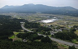 Panoramic view of the Kakutō Basin in Ebino City, Miyazaki Prefecture. The Ebino Interchange between the Kyushu and Miyazaki Expressways can be seen
