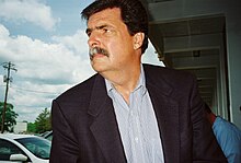 Mike Helton in 2008, looking into the distance.