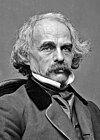 A black-and-white photograph of Nathaniel Hawthorne, bearing a mustache and medium-length hair