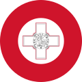 The roundel on the wings and fuselage of Maltese military aircraft consists of a George Cross proper fimbriated in red in the centre of a white disc, within a red disc. Whenever then national flag is painted on the side of an aeroplane, the hoist should be towards the front of the plane with the fly flowing aft.