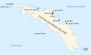 Outline map of the island of South Georgia and several offshore islands. South Georgia has a long irregular shape with many coves and deep bays. On the north shore the main whaling stations are marked: Prince Olav Harbour, Leith Harbour, Stromness, Husvik, Grytviken, Godtul and Ocean Harbour.