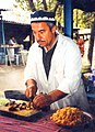 A man makes plov, the national dish of Tajikistan.