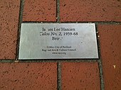 Metal plaque set in brick pavers