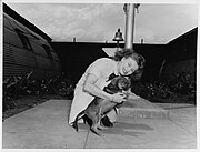 WAVE Y3c Betty Dickinson, with barracks mascot "Okinawa", assigned to Pearl Harbor, May 1945