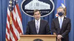 Demers in the DOJ press room announcing the charges against Chinese agents