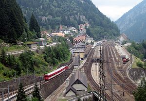 Railway tracks and station in a valley