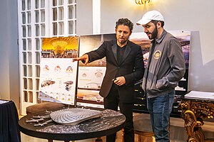 Salvadoran President Nayib Bukele at right, and Mexican architect Fernando Romero viewing a model of the Bitcoin City airport in 2022